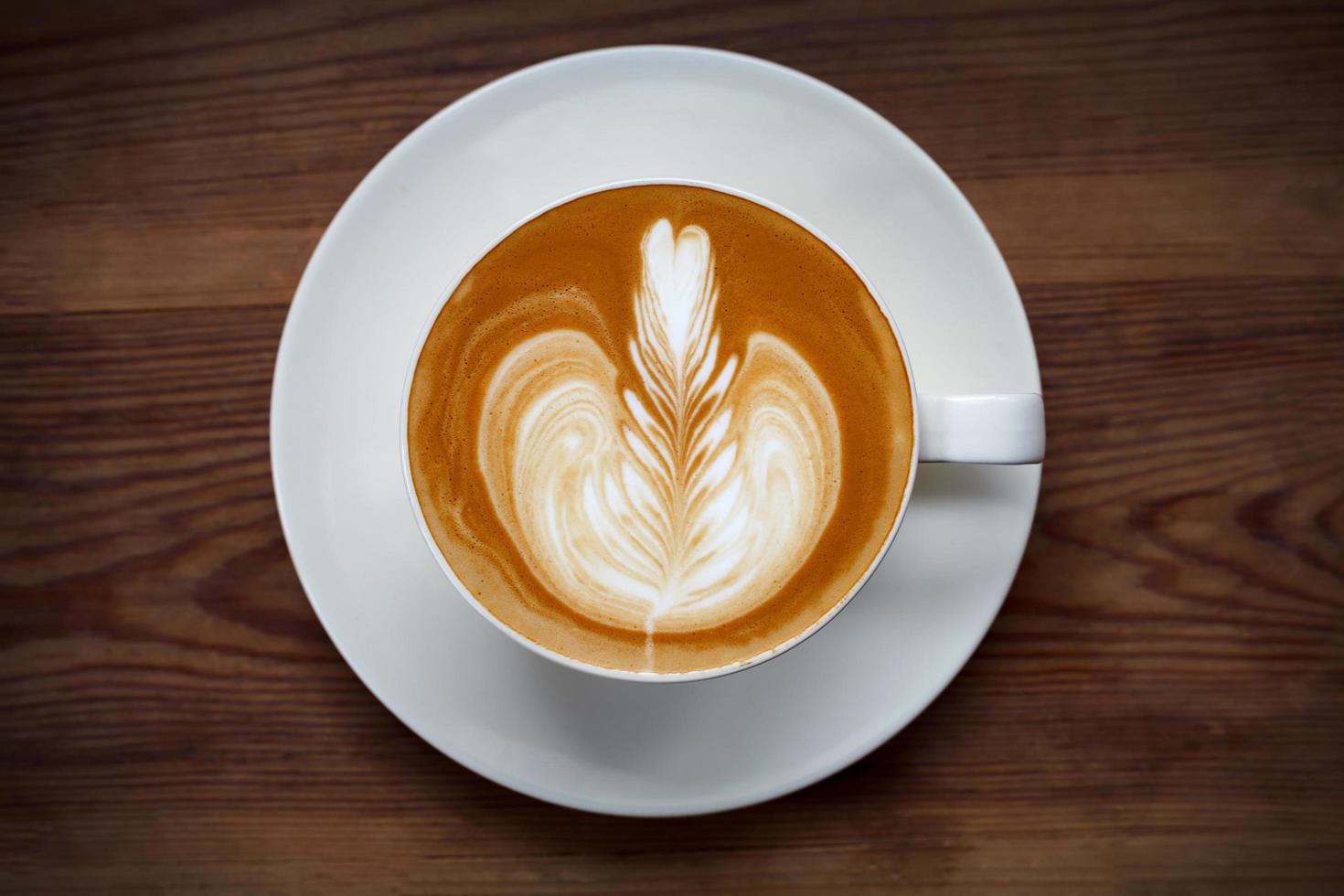 Top view latte art coffee on wood table 11042239 Stock Photo at Vecteezy