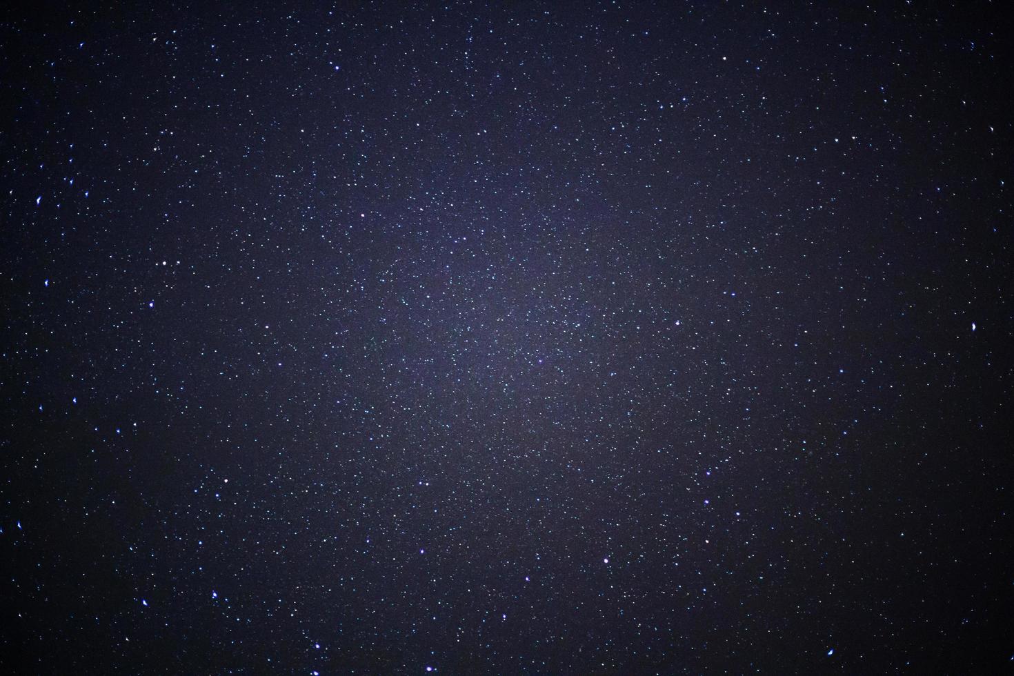 Starry night sky and milky way galaxy with stars and space dust in the universe photo