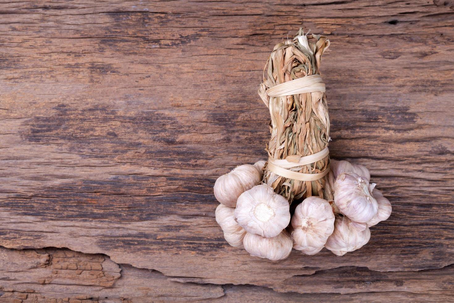 garlic on wooden background photo