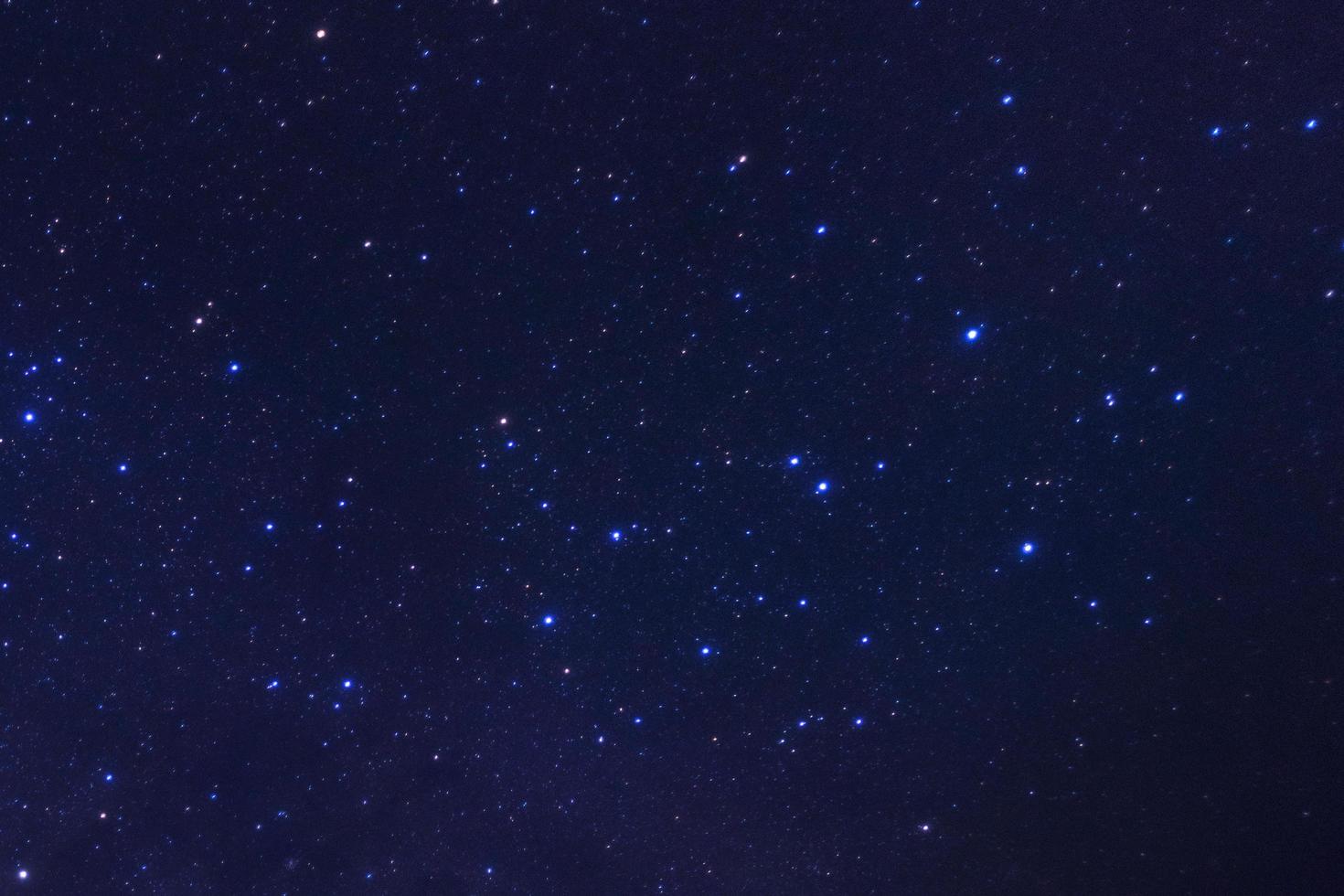 Starry night sky, Milky way galaxy with stars and space dust in the universe, Long exposure photograph, with grain. photo