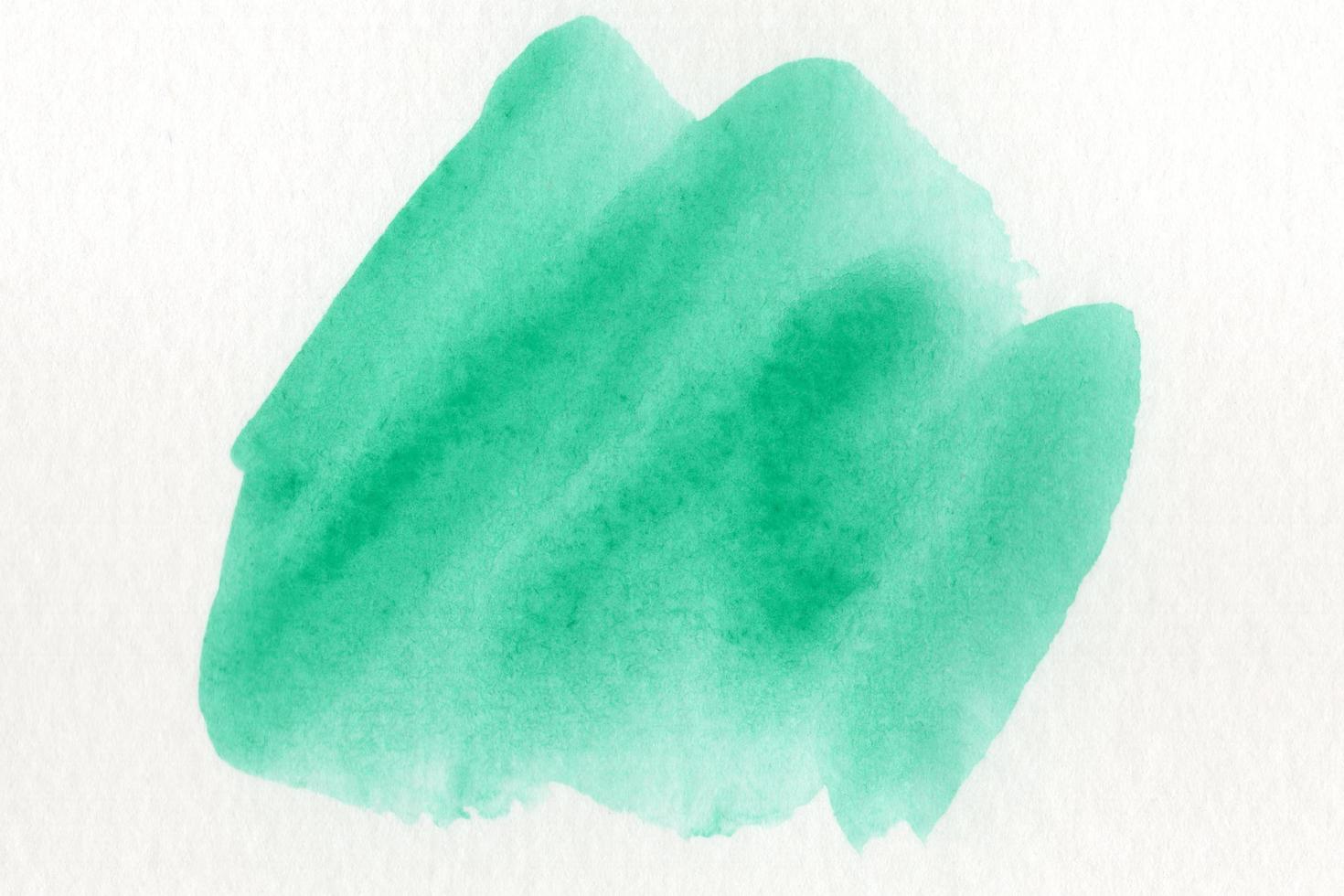 Abstract green watercolor on white background.The color splashing on the paper.It is a hand drawn. photo