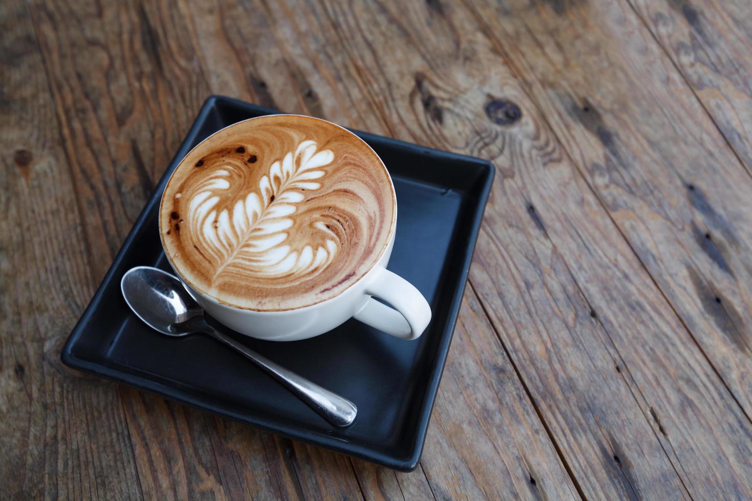 A cup of coffee mocha on wooden photo