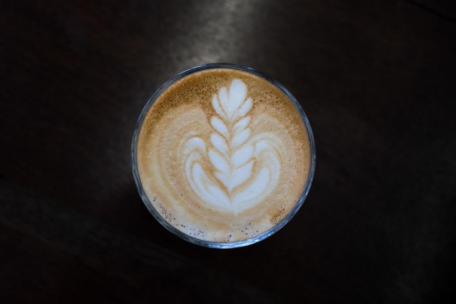 Coffee latte art on black table, Top view photo