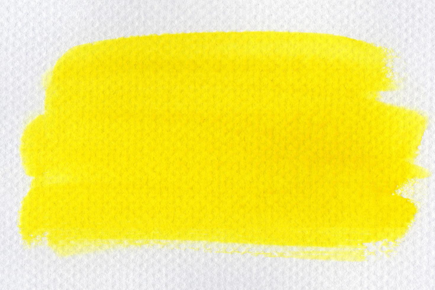 Abstract yellow watercolor on white background.The color splashing on the paper.It is a hand drawn. photo