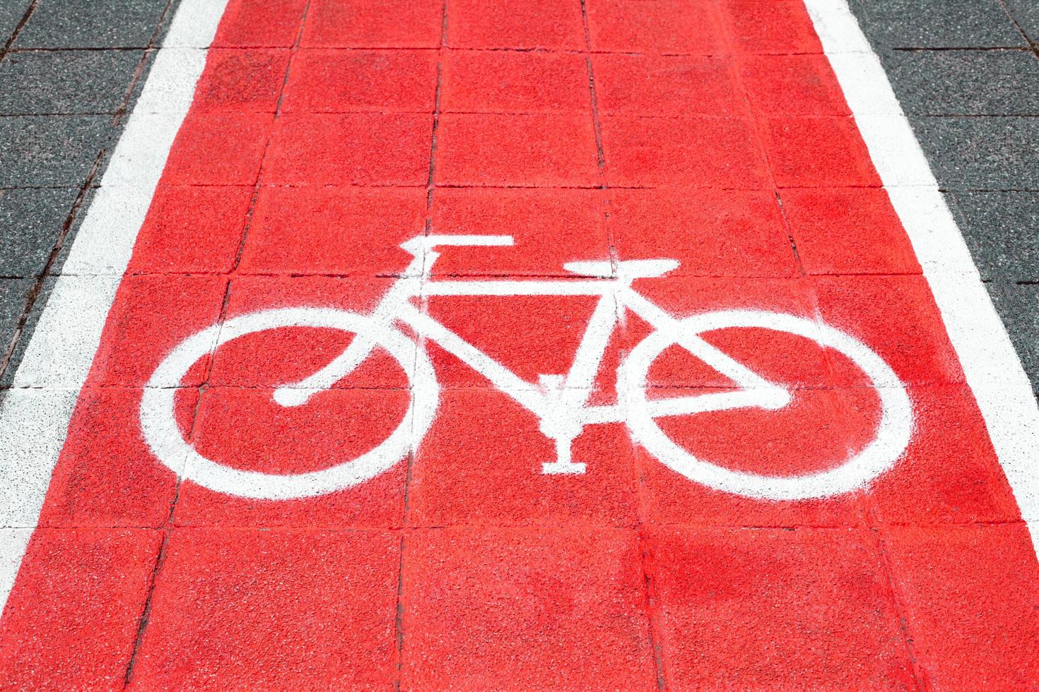 Bike lane and white bike symbol photo