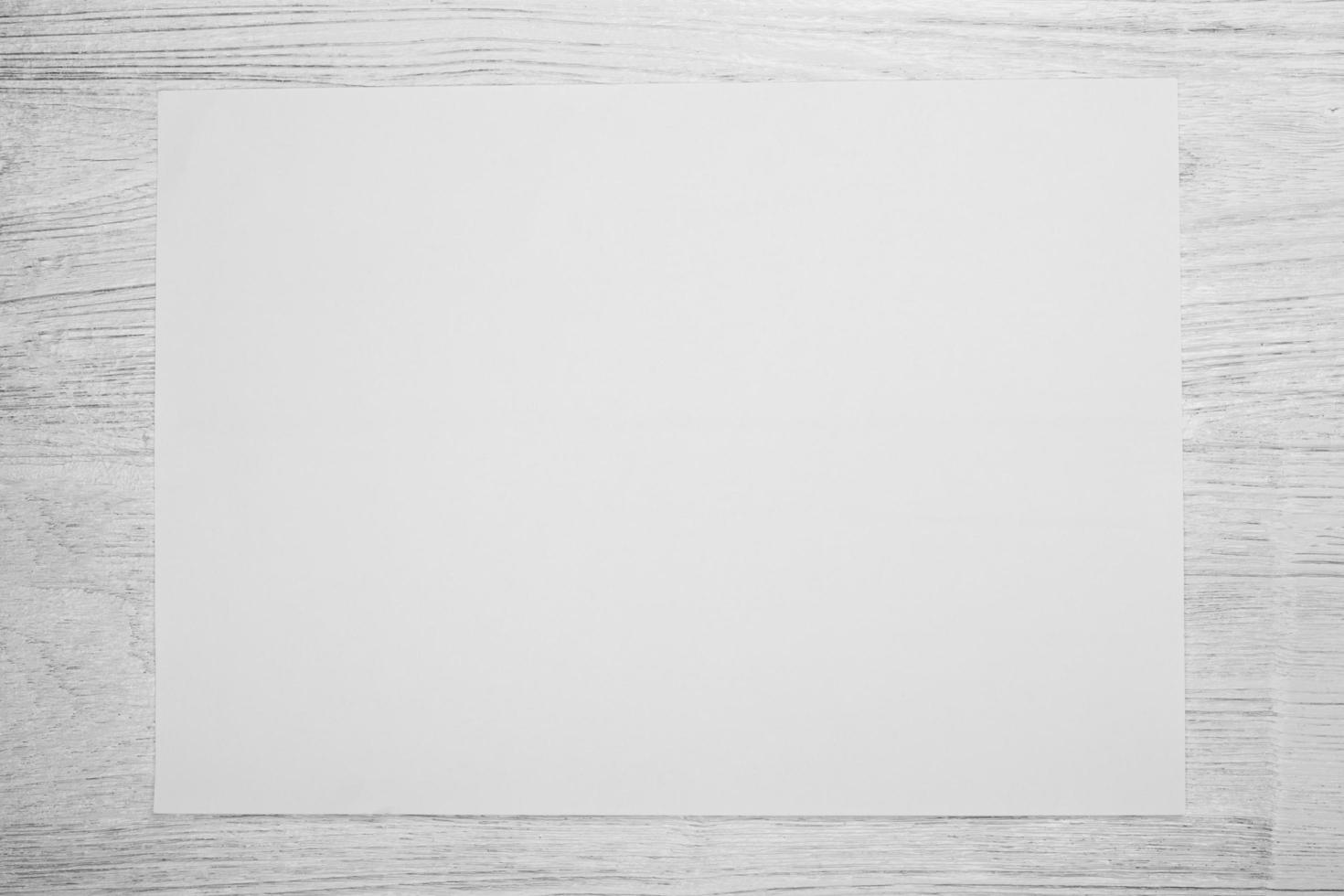 white paper on white wood table photo