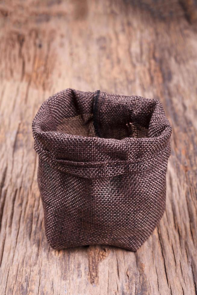 open small sack on wood photo