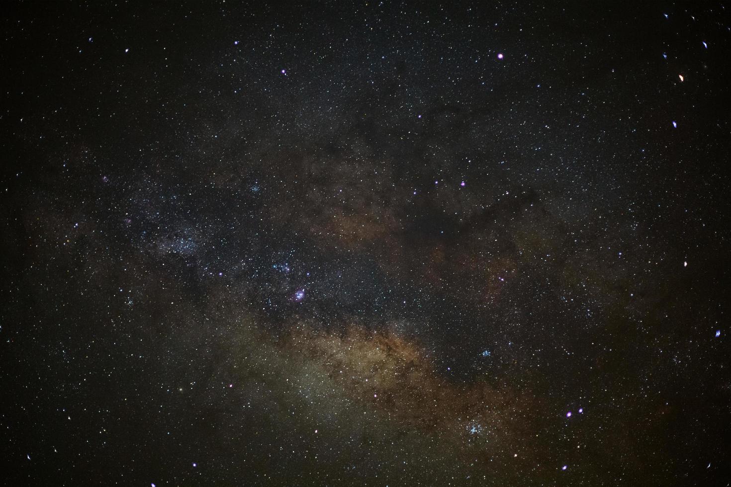 Close-up of Milky way galaxy with stars and space dust in the universe, Long exposure photograph, with grain. photo