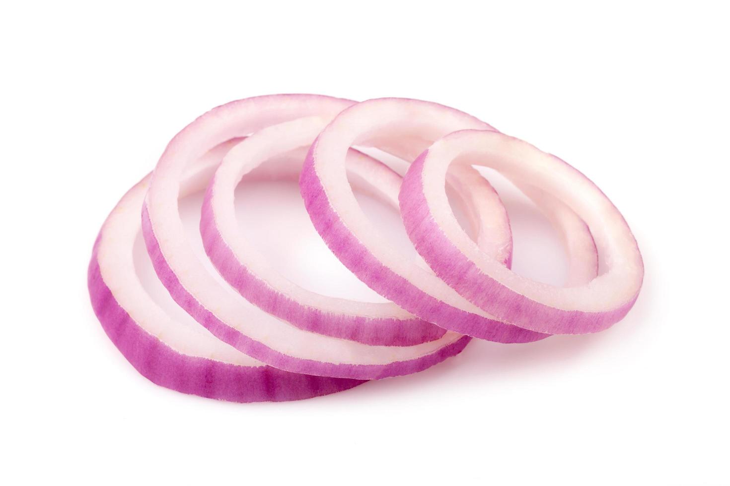 red onion slices on white background photo
