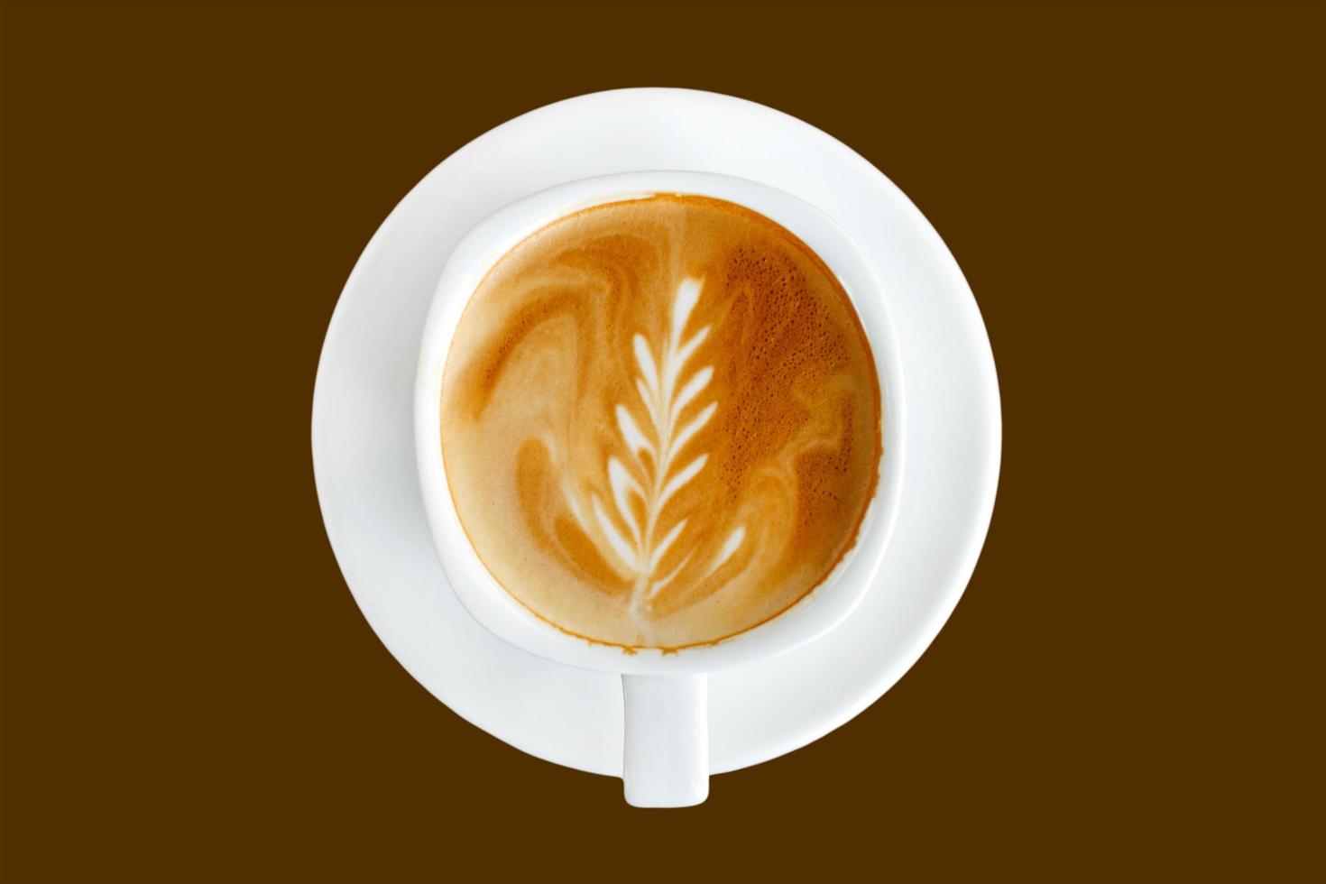 Top view latte art coffee on brown background photo