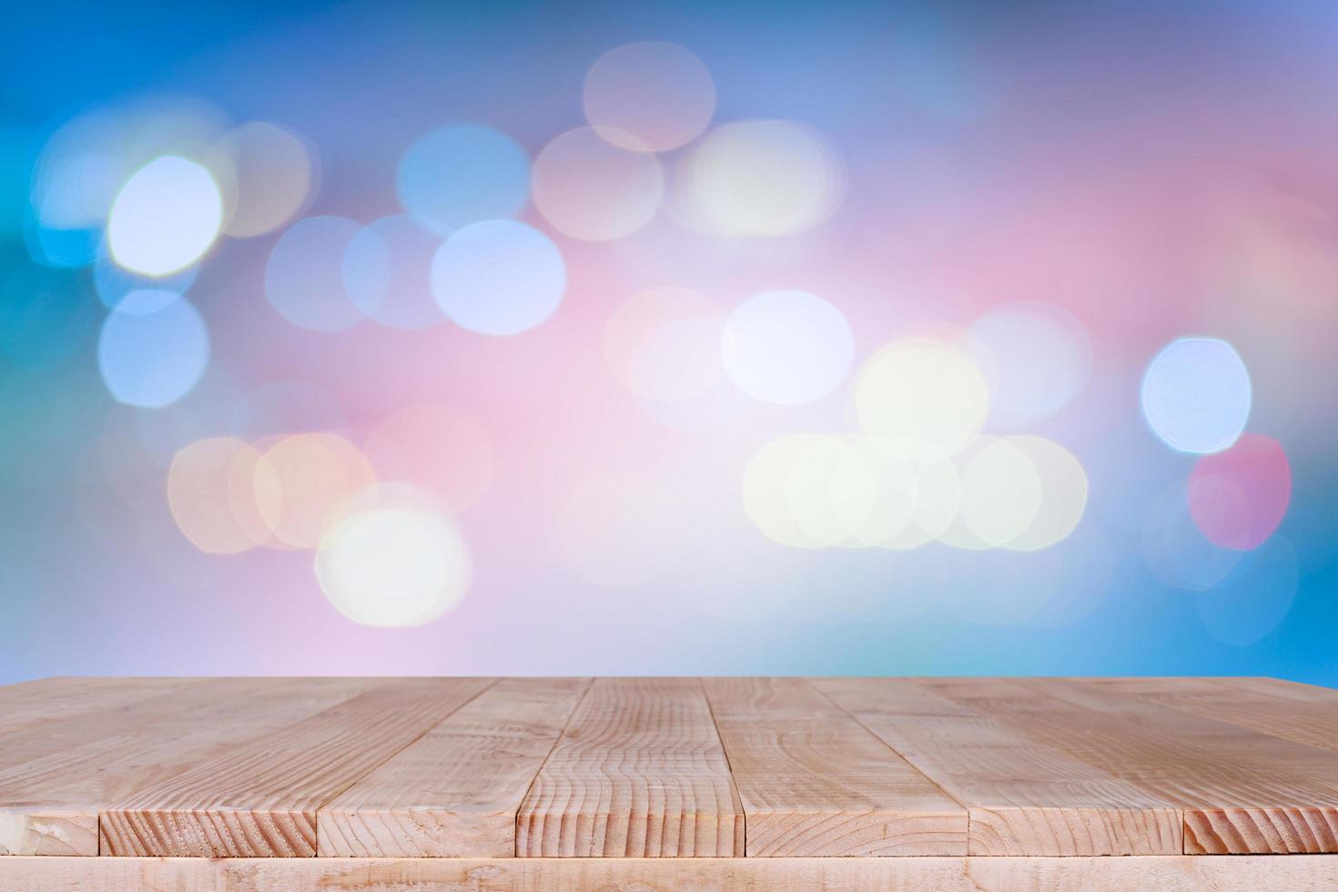 Wood table top on bokeh orange background - can be used for montage or display your products photo