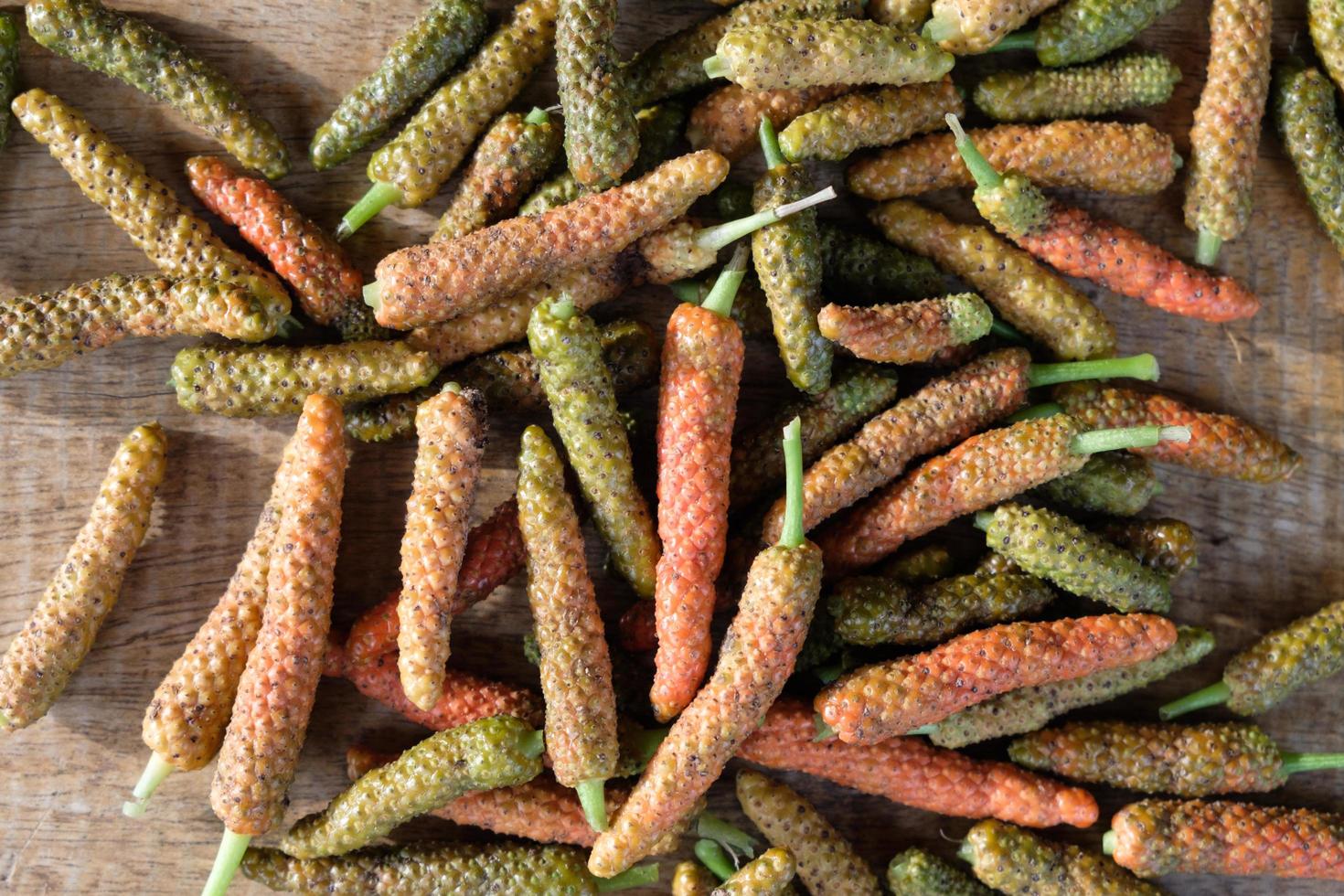 Long pepper or Piper longum on wooden table photo