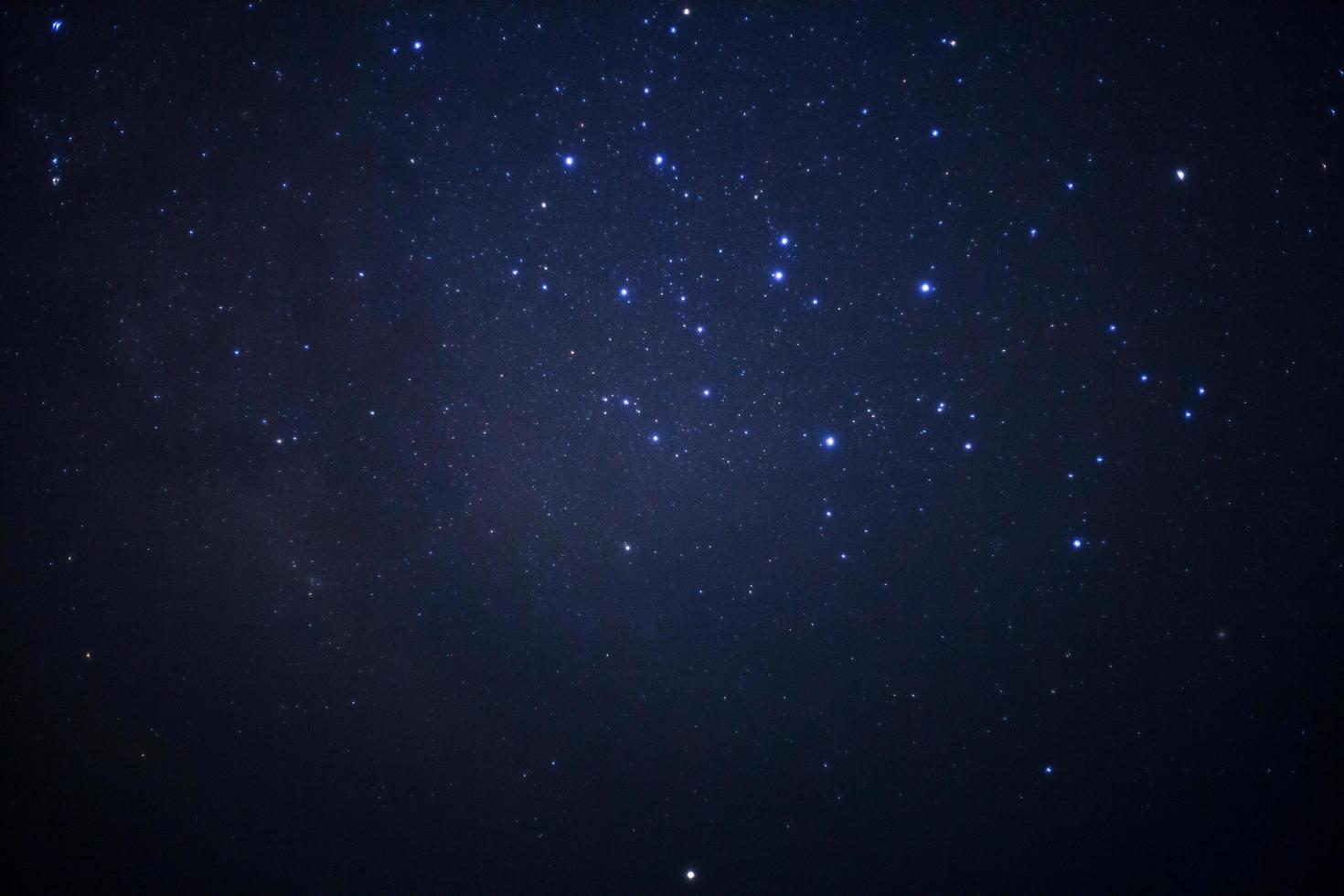 Starry night sky and milky way galaxy with stars and space dust in the universe photo