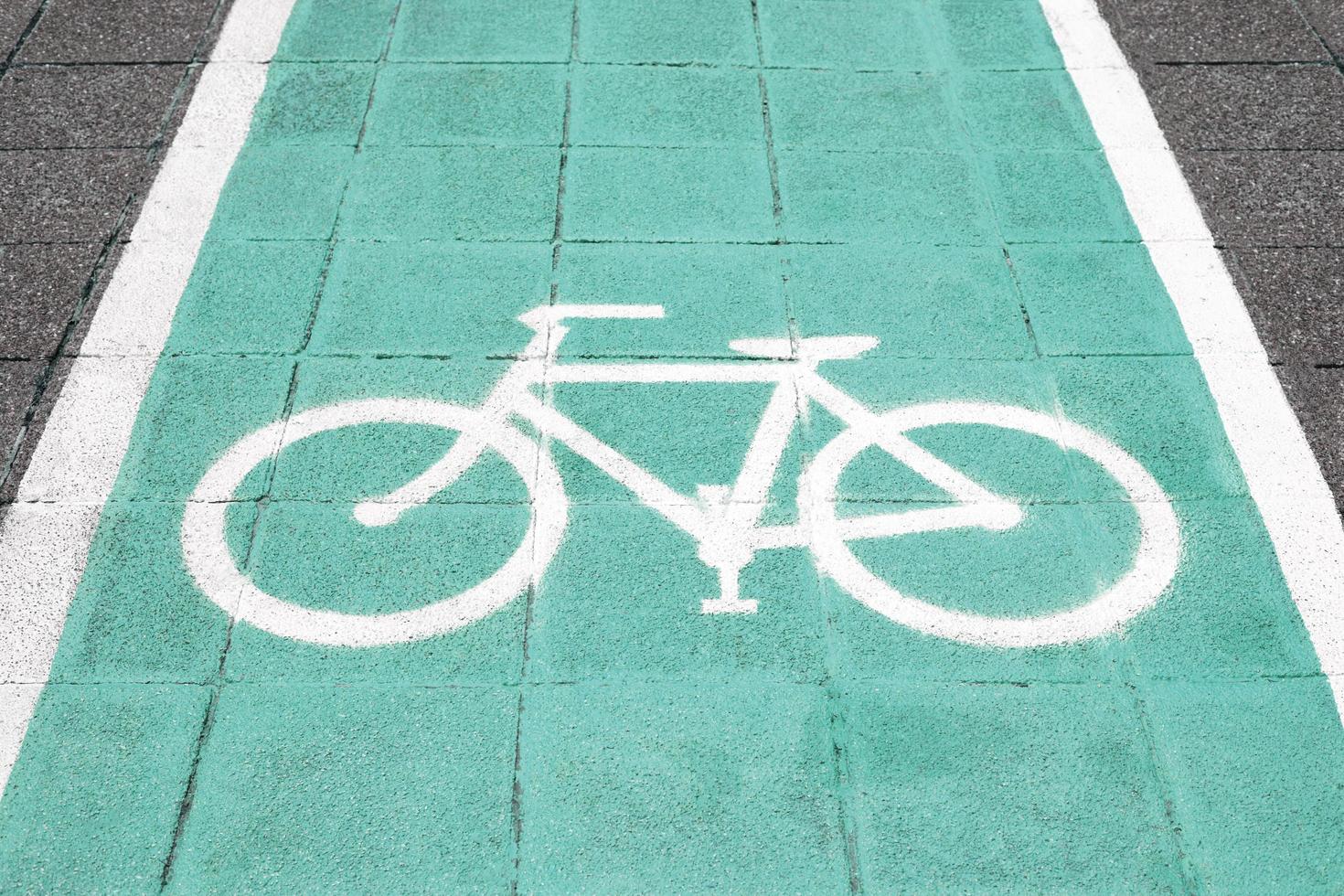 Bike lane and white bike symbol photo