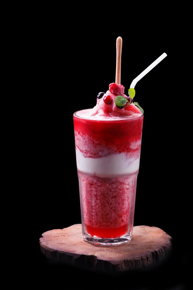 Raspberry smoothie on black background photo
