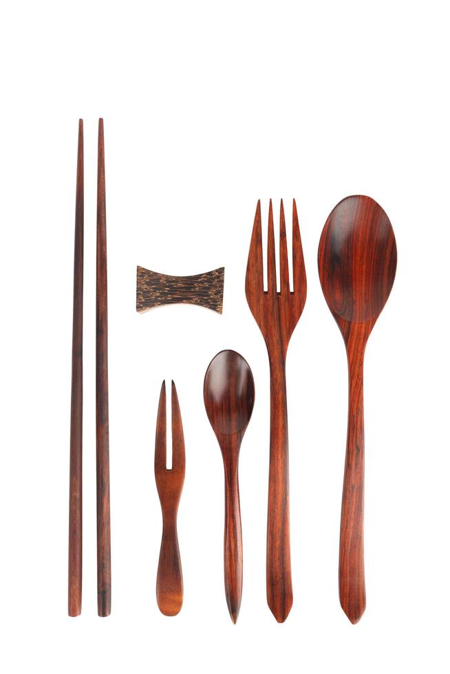 Wooden kitchen utensils. Isolated on a white background photo