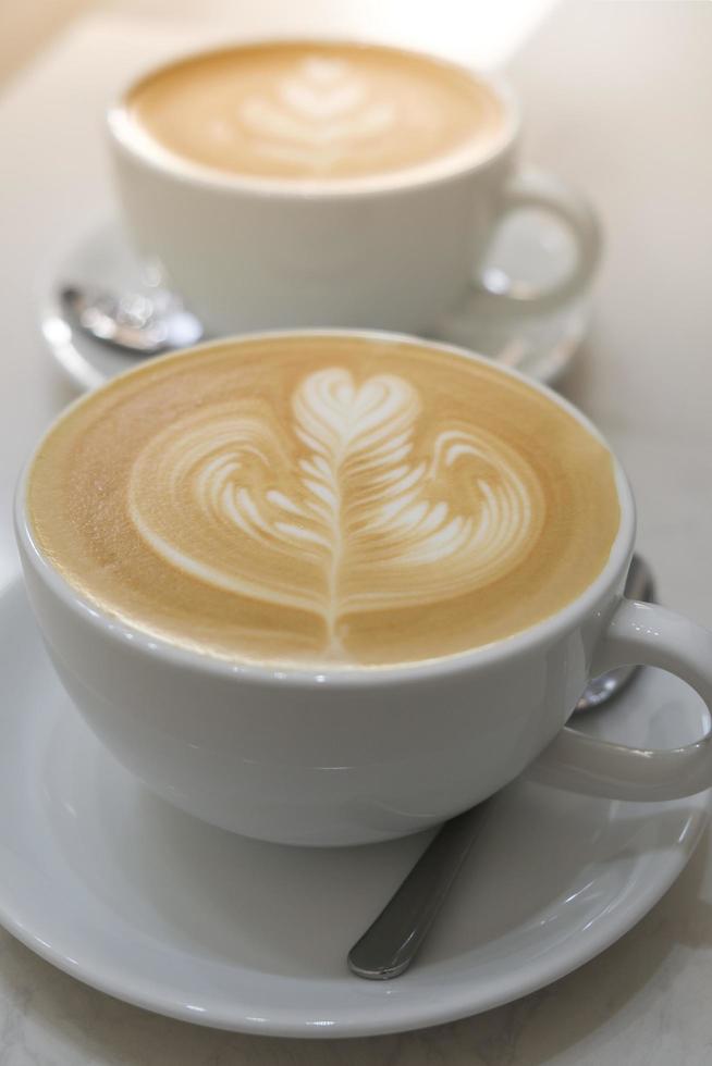 Coffee latte art in coffee shop photo