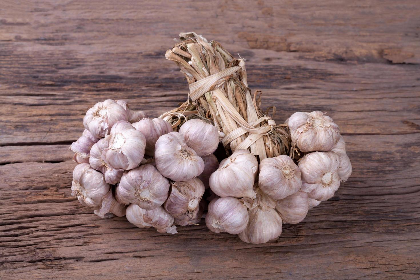 garlic on wooden background photo