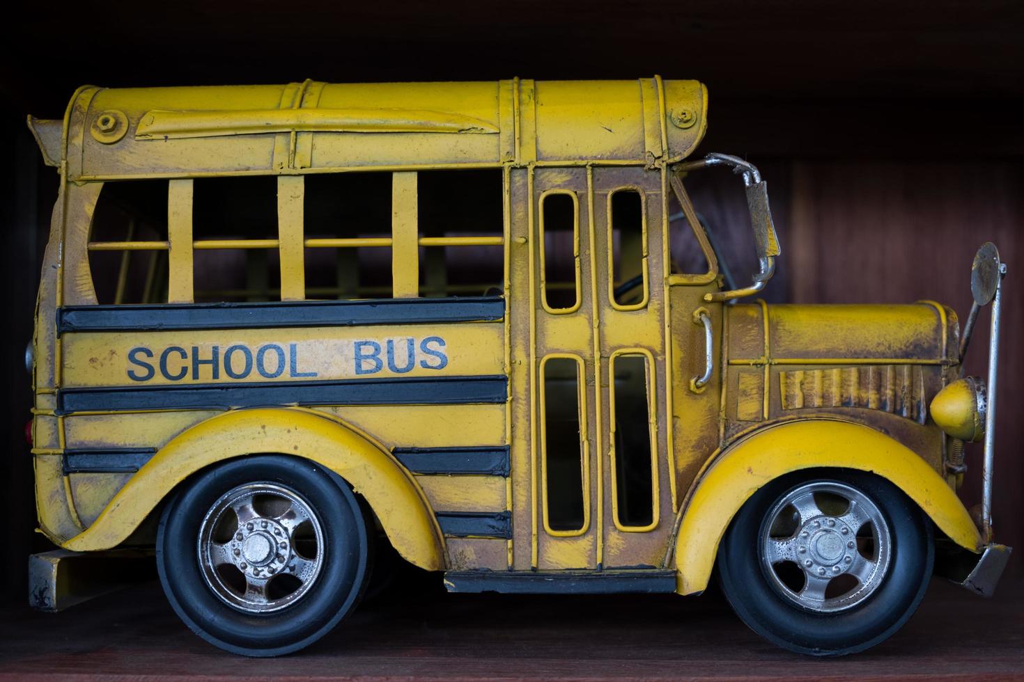 An old yellow school bus model photo
