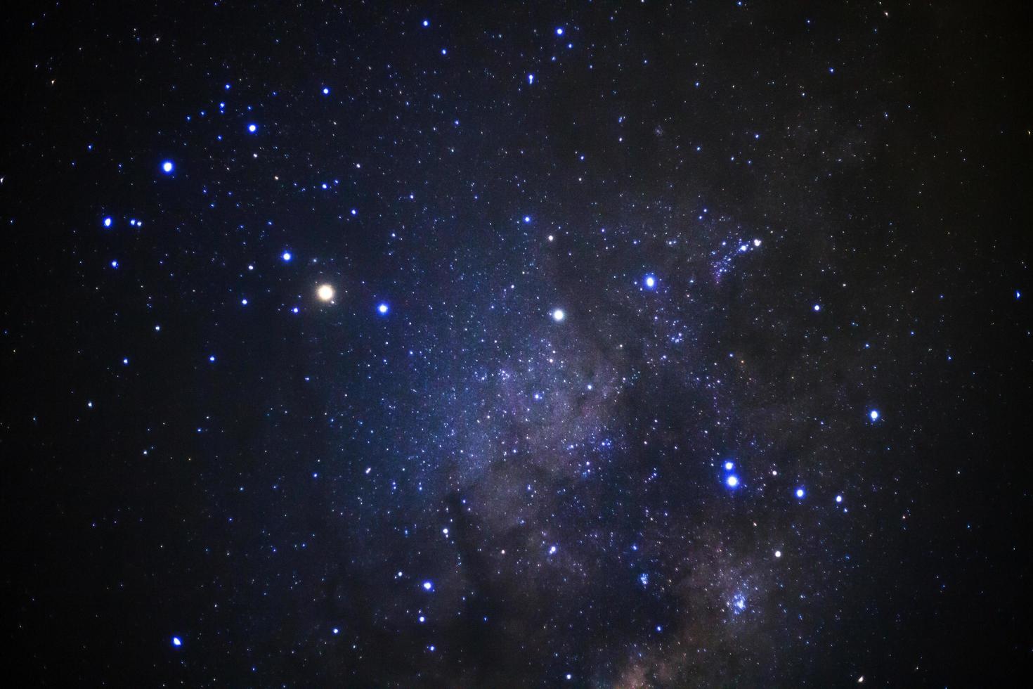 Milky way galaxy with stars and space dust in the universe, Long exposure photograph, with grain. photo