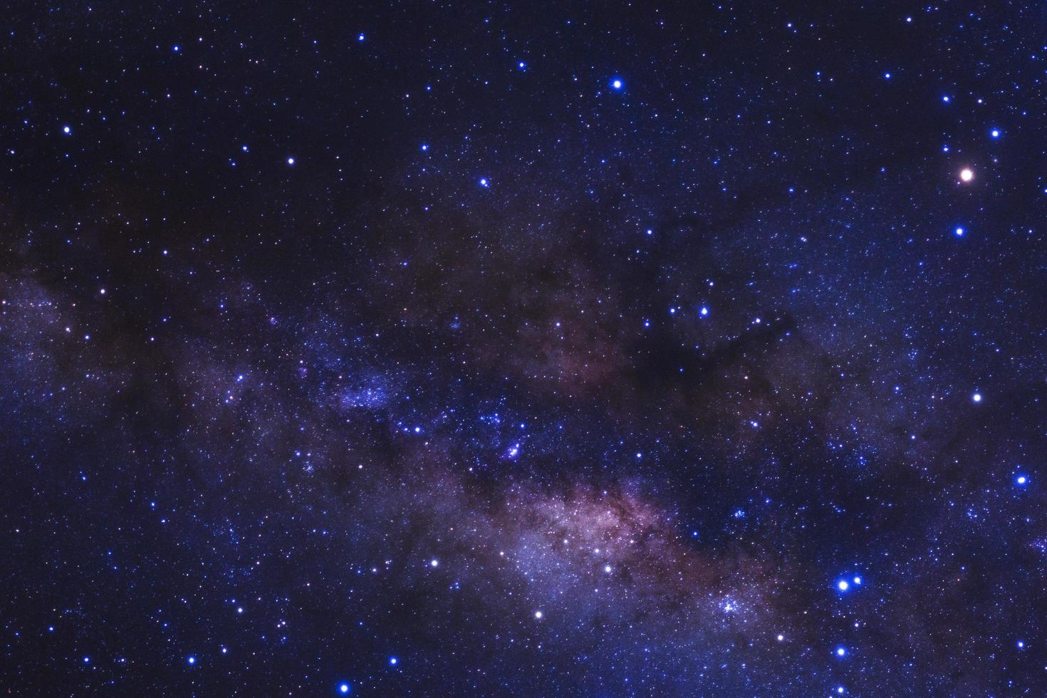 Milky way galaxy with stars and space dust in the universe, Long exposure photograph, with grain. photo