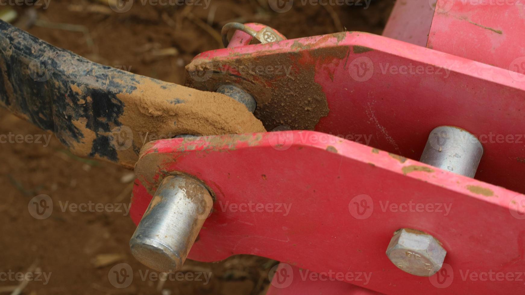 The iron corners of the motorbike that have been damaged hit the ground because they have been used too much on unpaved roads photo