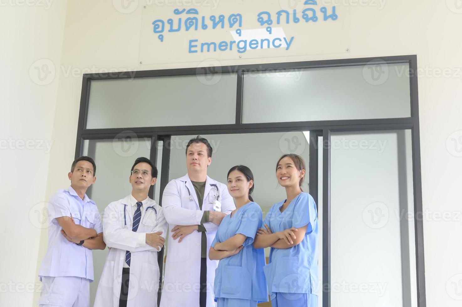 An Asian professional confidence medic team are walking  in hospital, health care concept . photo