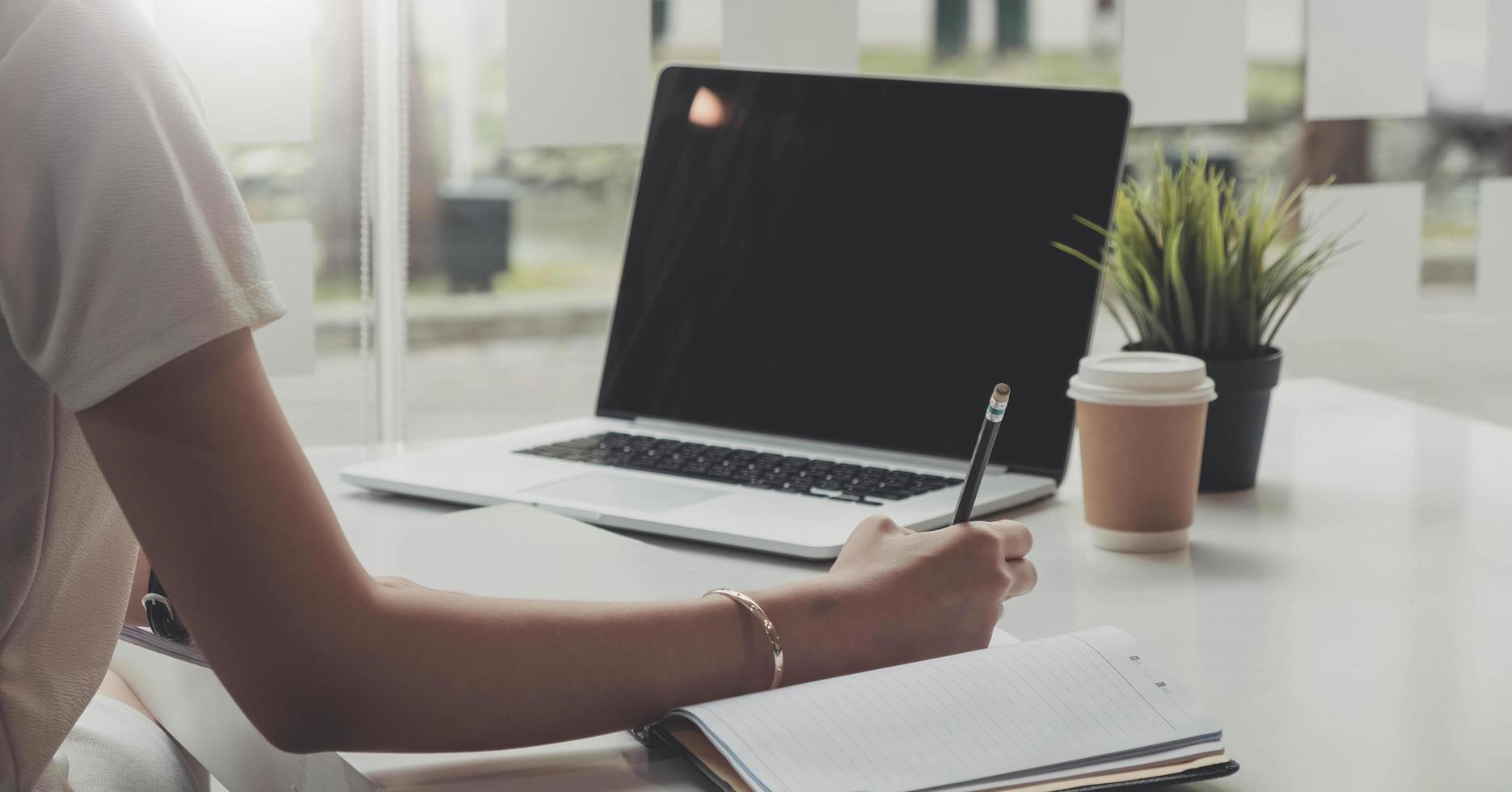 Picture of woman hand filling in invoice paper,Online Taxes And Invoice Billing Electronic Management. photo