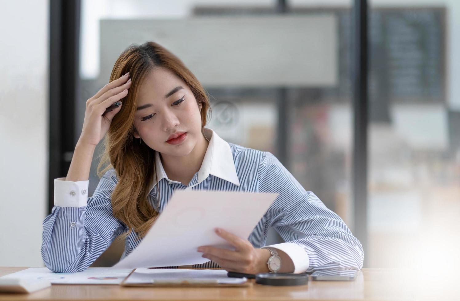 Asian women are bored from their online studies, have a sad face and have been tired from their studies for a long time. photo
