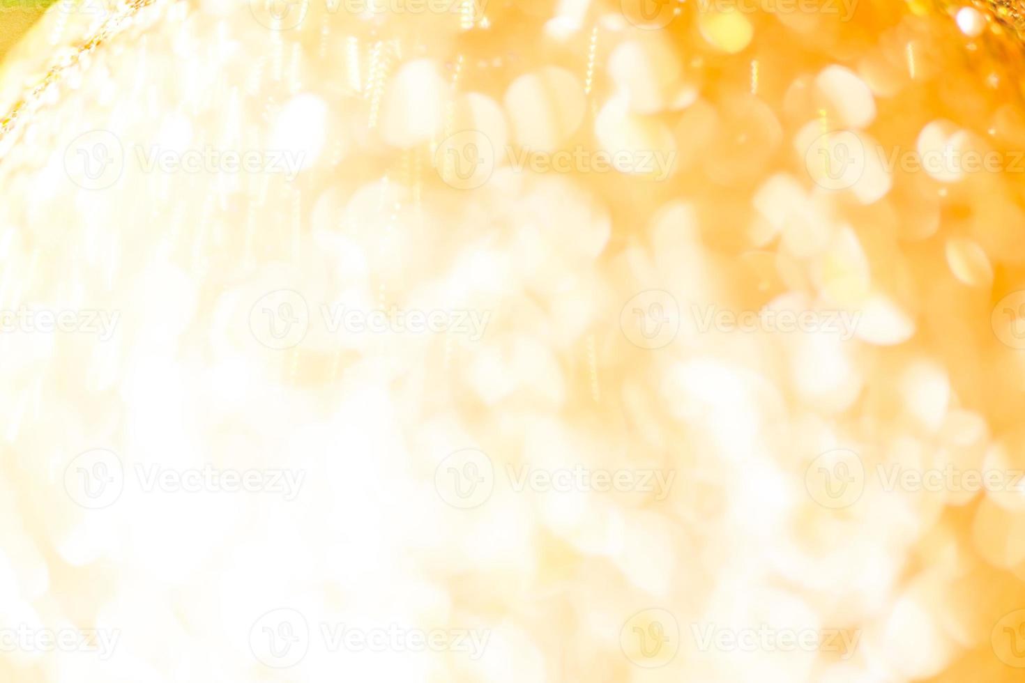 Bokeh Golden shiny glitter texture background. Happy new year and Christmas background. photo