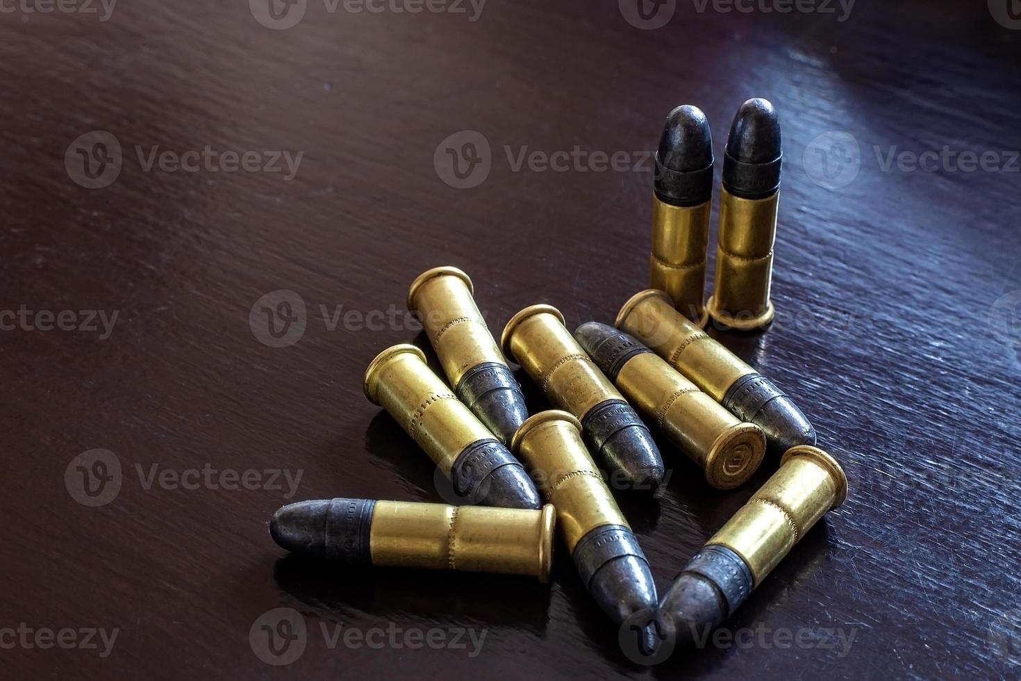 Bullets on the table. Ammunition. Concept of crime photo