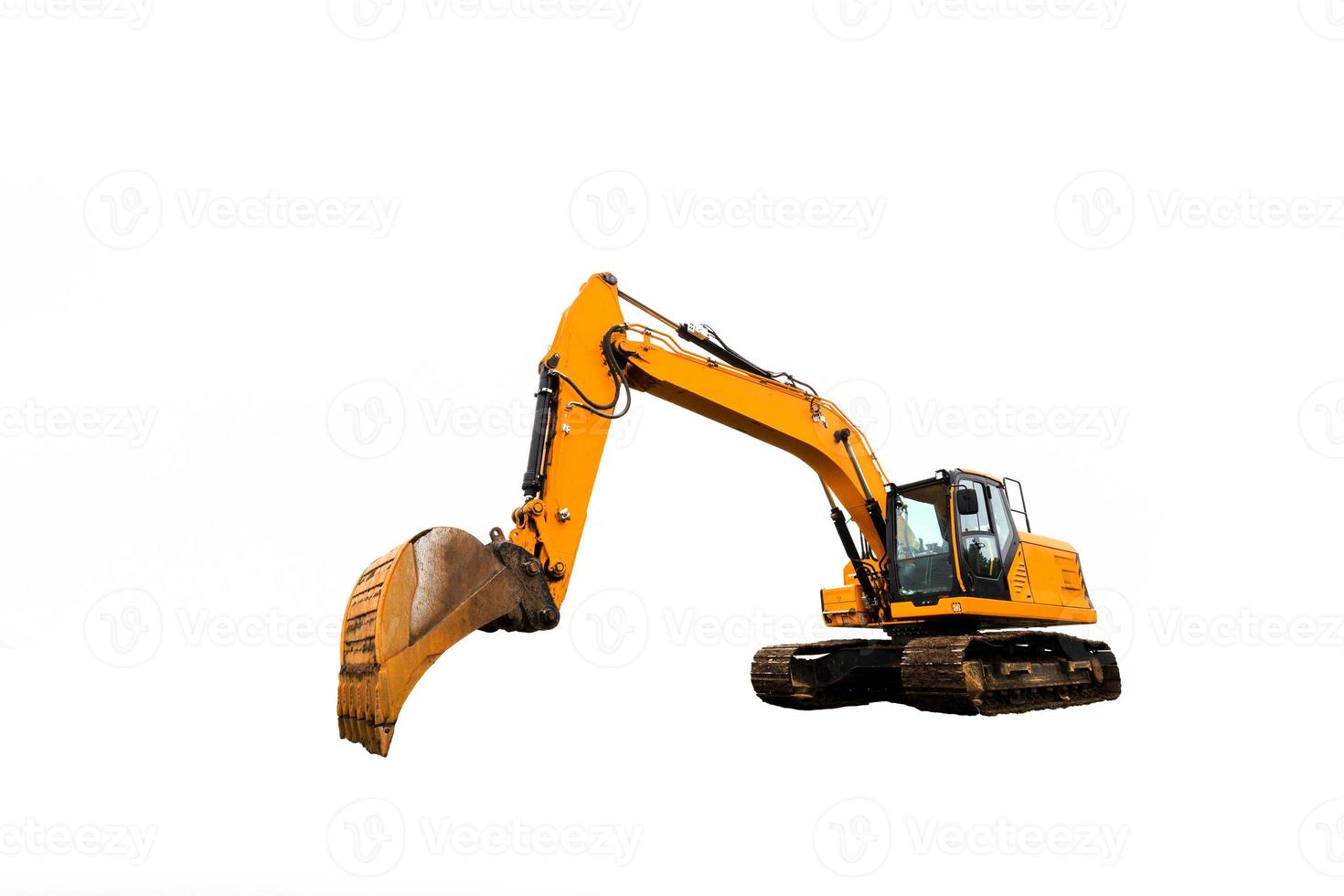 Yellow excavator in construction site isolated on white background. photo