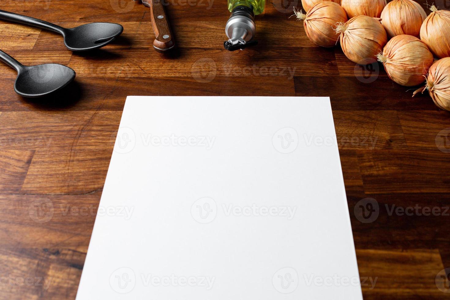 Restaurant cafe menu empty mock up for concept design. Business concept. Template design. Information concept with kitchen objects on wooden table photo