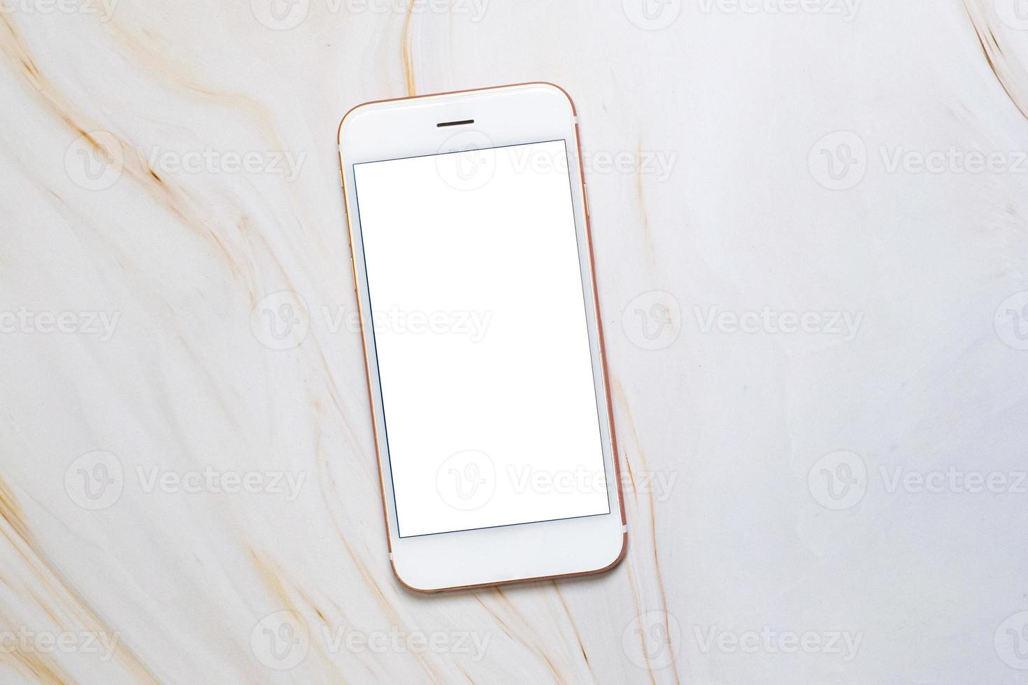 Flat lay Smartphone with blank white screen and copy-space on marble table. Elegant Design with Space for placement your background,Template mock up for montage your design and products photo