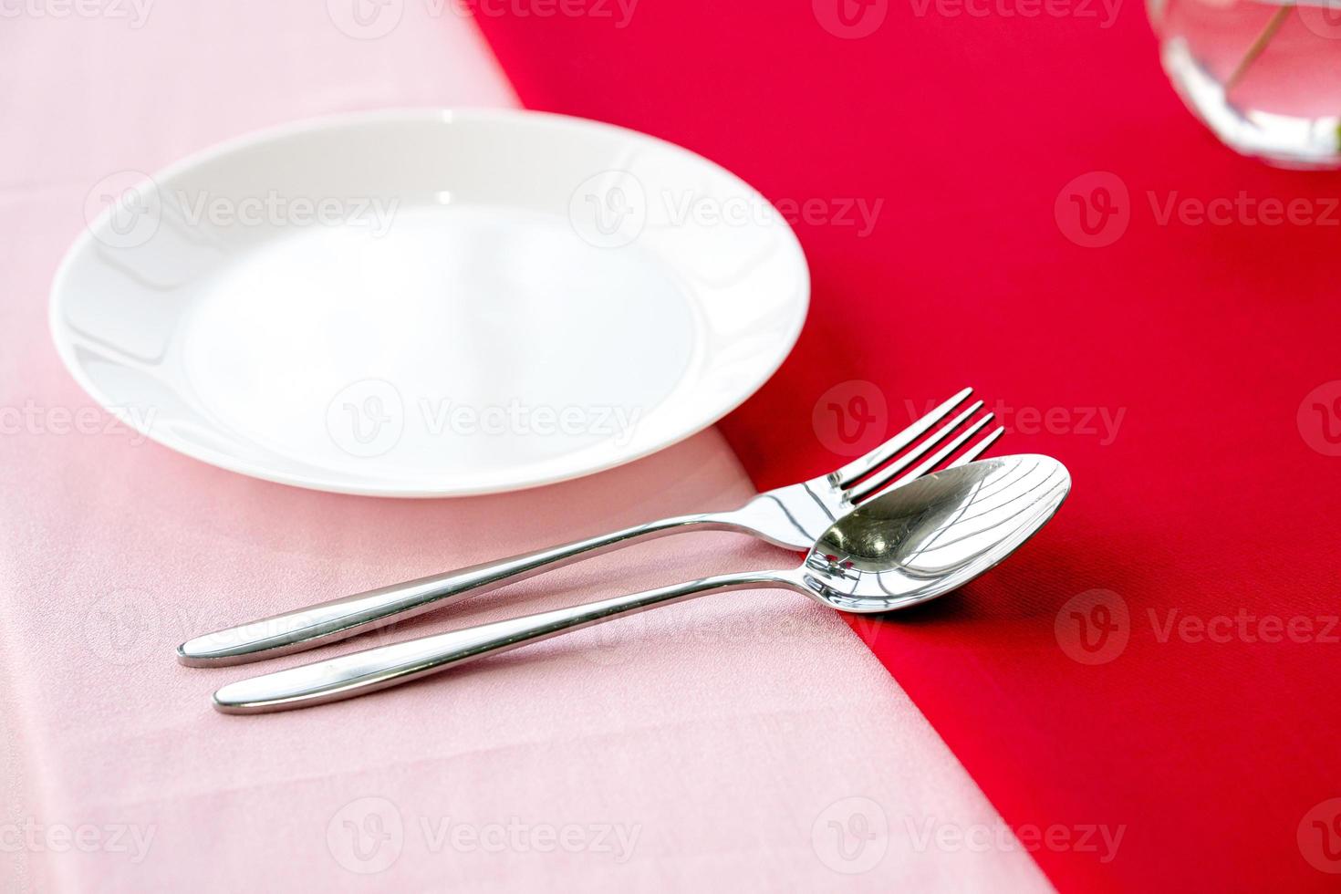 Dinner plate, fork and spoon photo