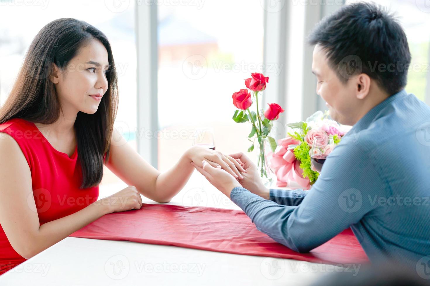 Unhappy girl refusing to marriage proposal of boyfriend photo