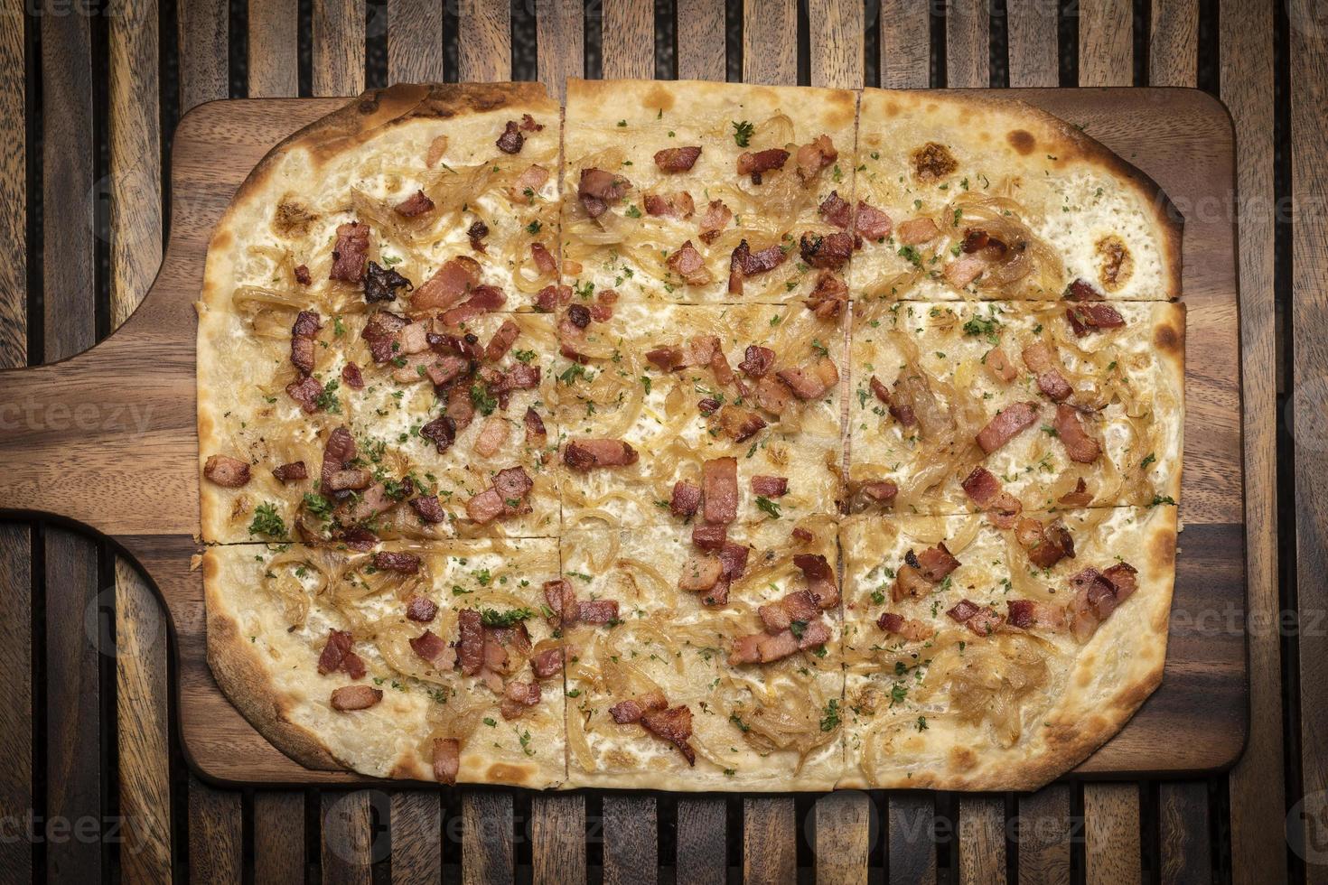 Flammkuchen tarte flambee rectangular pizza with bacon and chicken photo