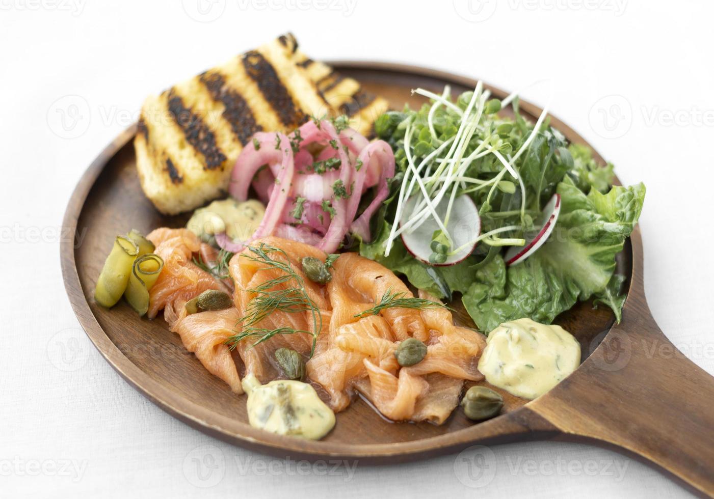 salmon gravlax platter with salad and toast in sweden photo