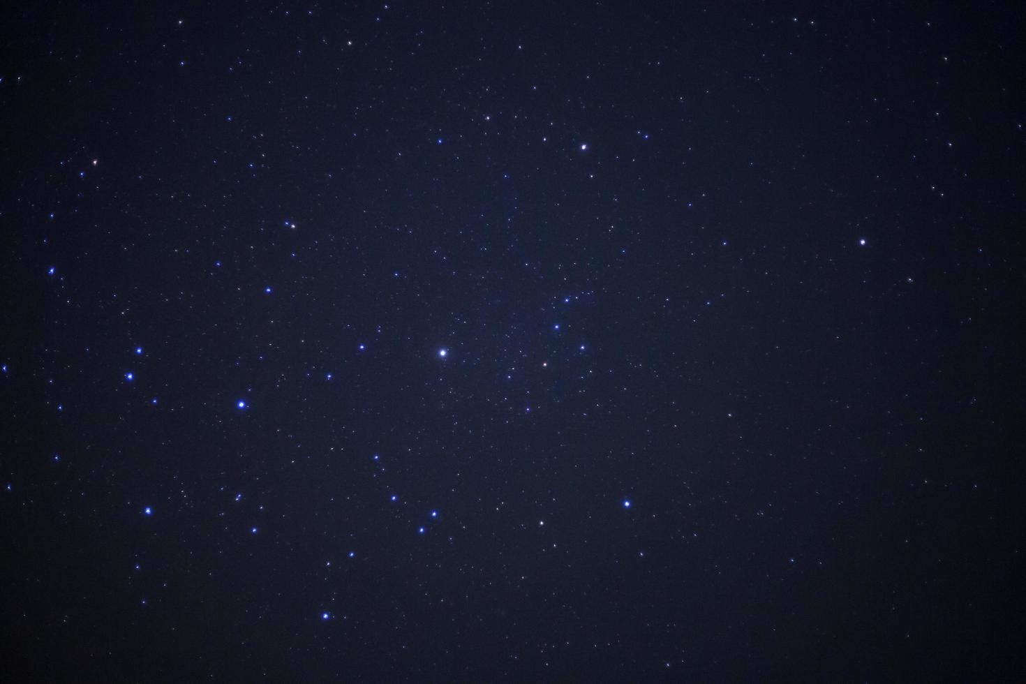 Star in night sky and milky way galaxy. Long exposure photograph.with grain photo