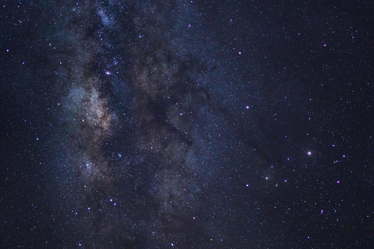 Starry night sky, Milky way galaxy with stars and space dust in the universe, Long exposure photograph, with grain. photo