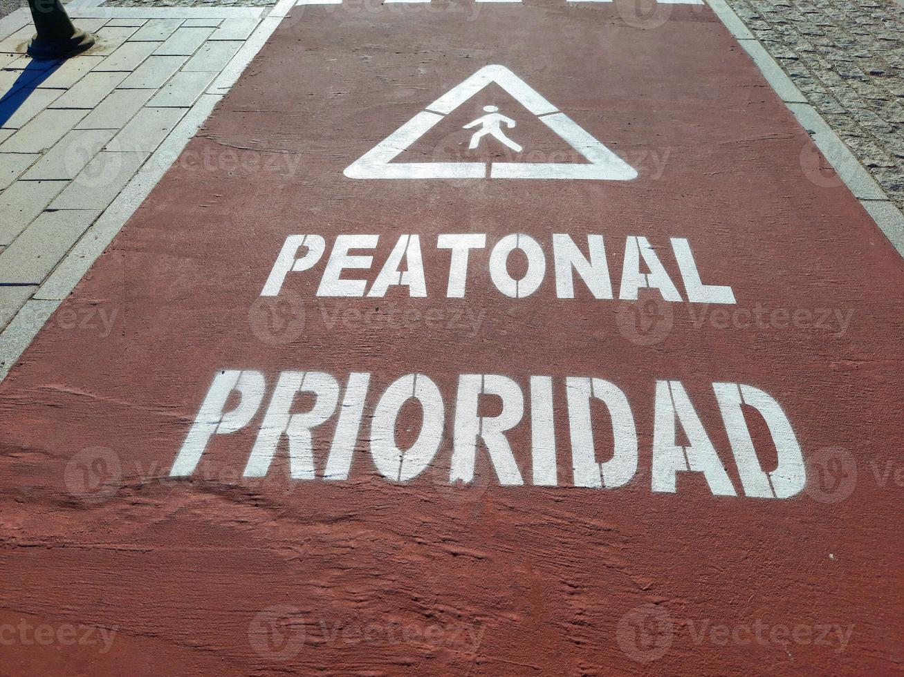 Bike lane where you can see pedestrian priority photo
