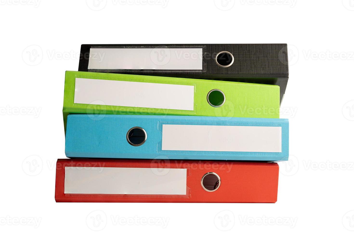 File Folder Binder stack of multi color on table in business office. photo