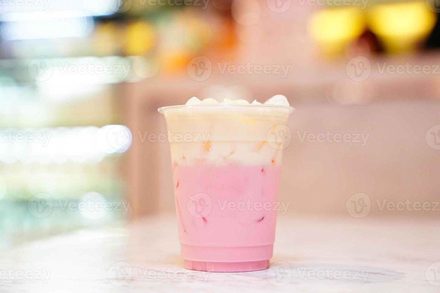 Pastel shades Pink milk with whipping cream. photo