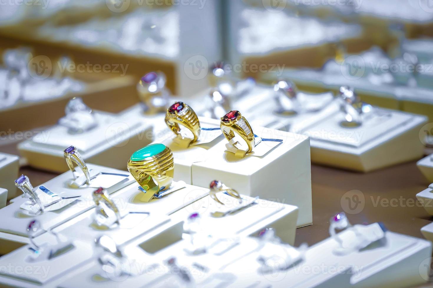 Golden ruby and jade ring in display mirro box. photo