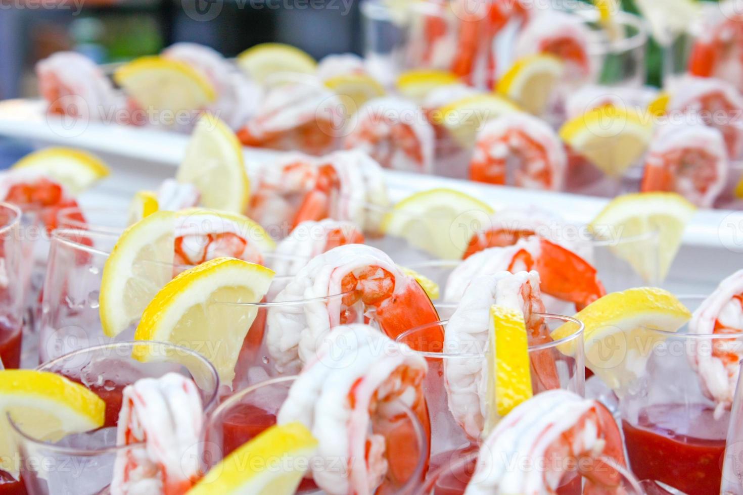 Boiled shrimp with lemon beside before appetizer. 11058426 Stock Photo