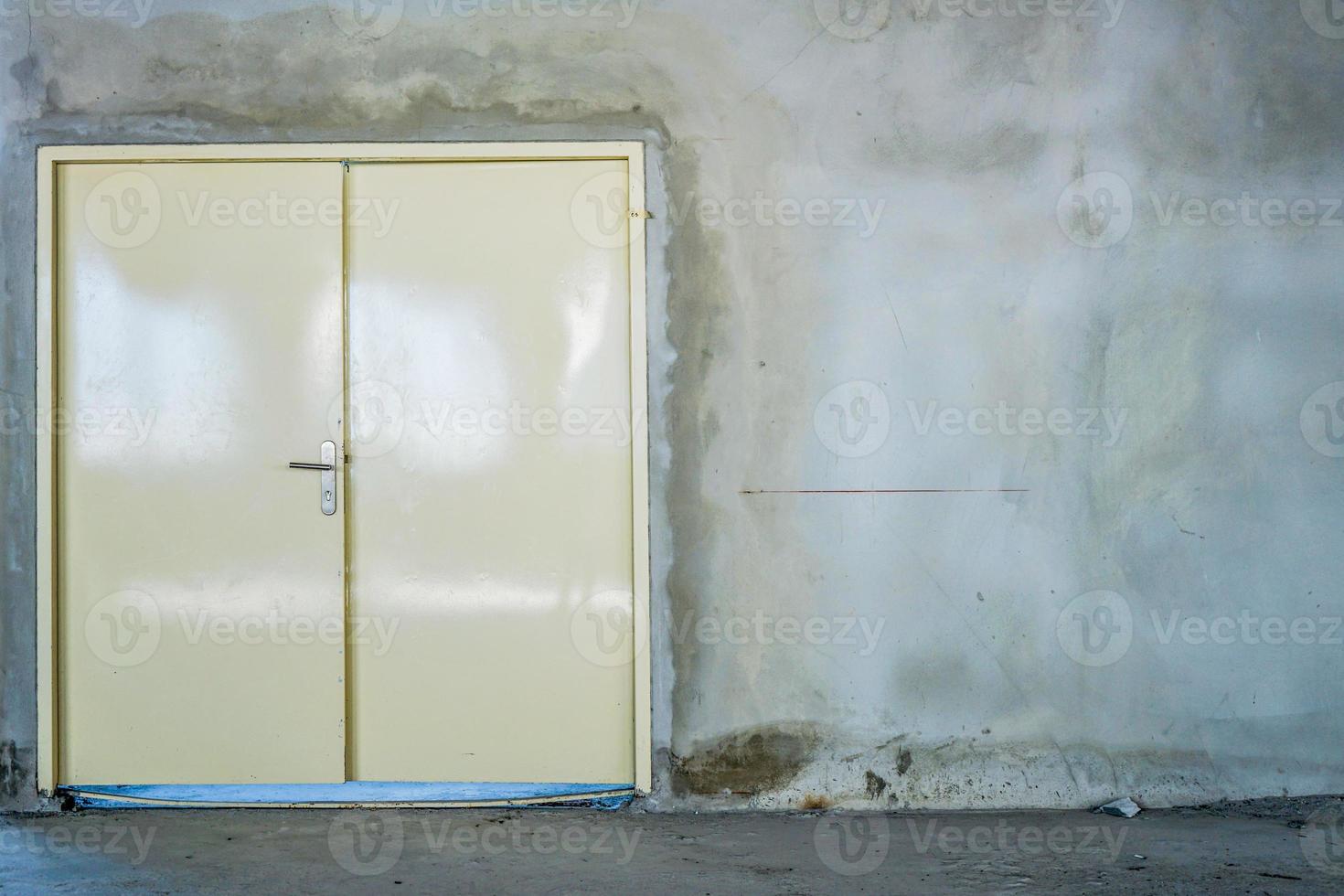 Steel door at the construction site inside the building. photo