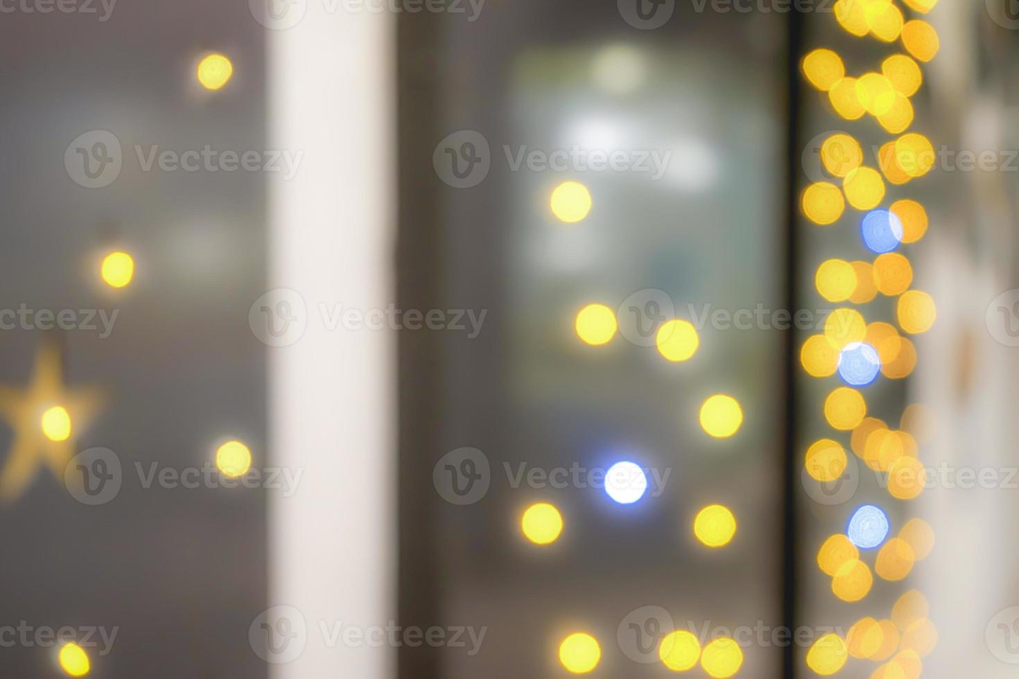 Blur abstract onion ring yellow and orange bokeh and Star shape bokeh withe plain grey background. photo