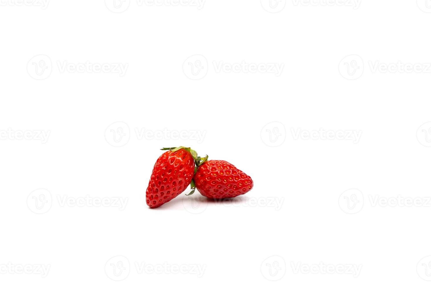 two portrait isolated fresh strawberries on the pure white backgroud in studio light. Clipping path. photo