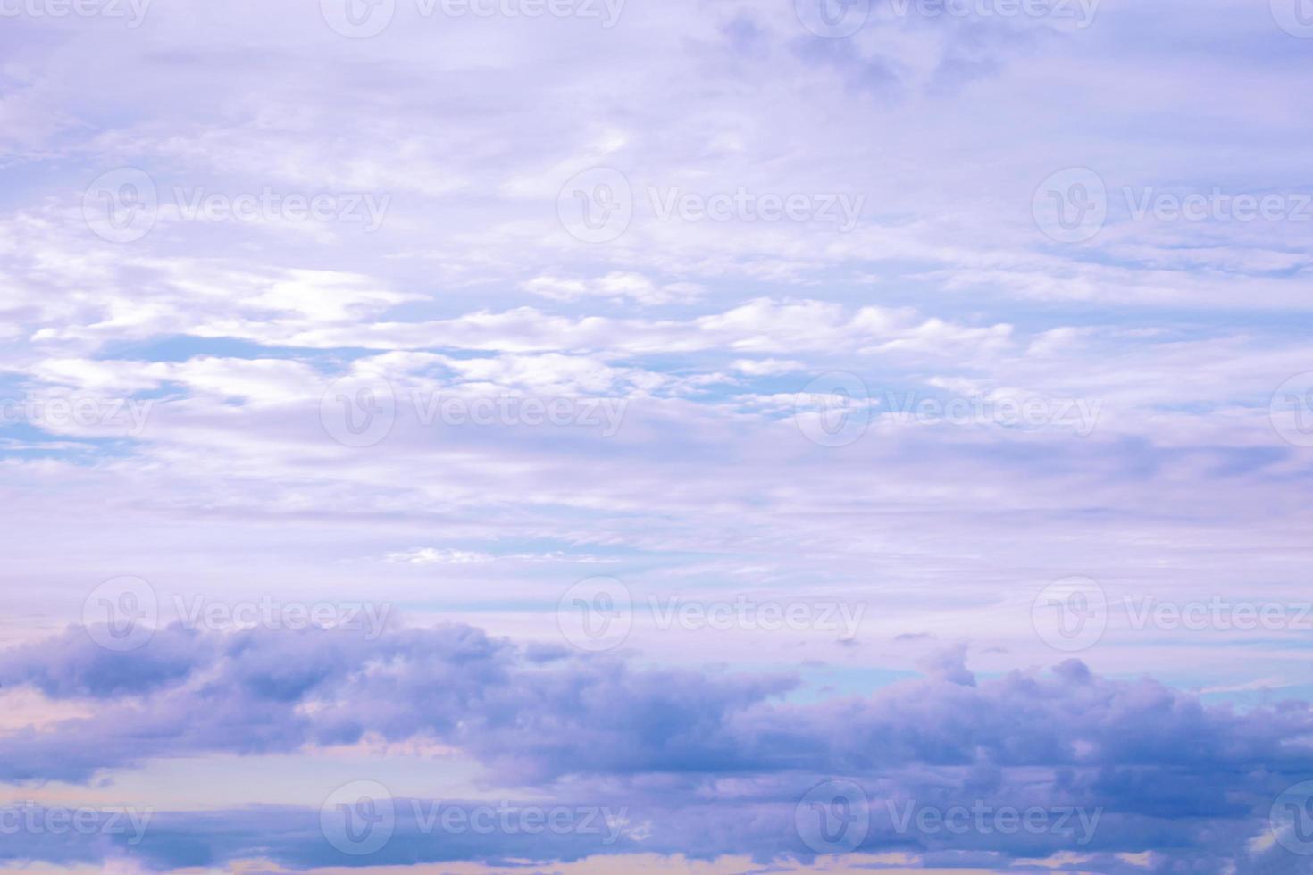 Blurred background. Blue sky and white fluffy clouds. photo