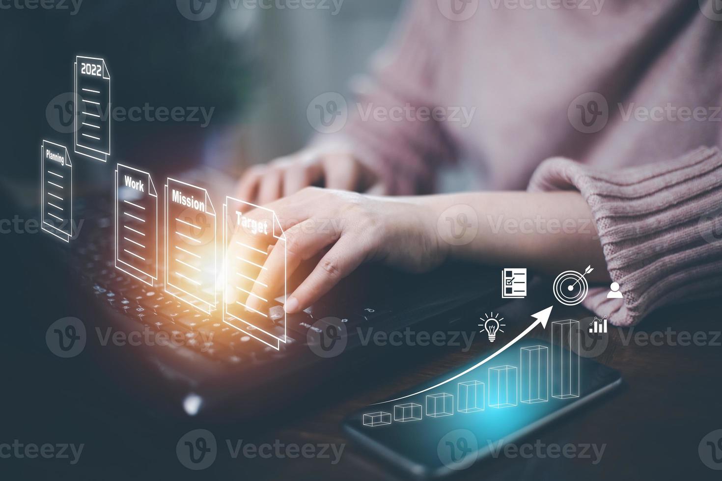 Concept Working and planning for New year 2022. Businessman using laptop and plans for the new year 2022 in a digital laptop or computer document. Business management, big data,finance technology. photo